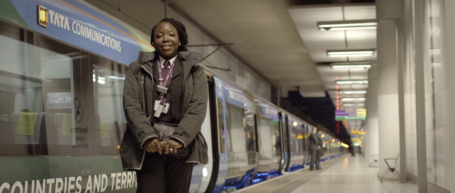Woman standing by train
